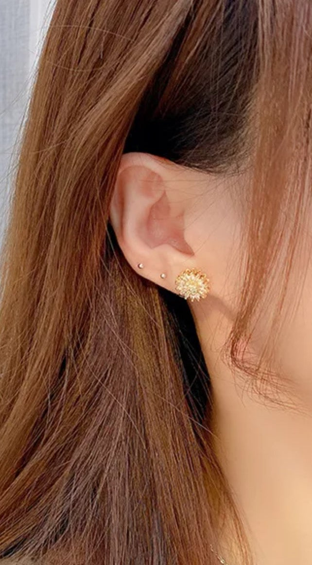 Aretes giratorios flor anti-ansiedad