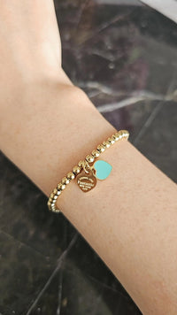 Corazon teal dorado brazalete